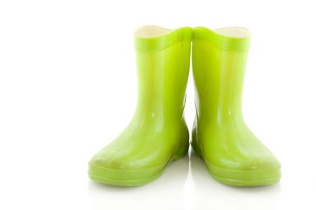 Green rubber child boots for rainy weatherの写真素材