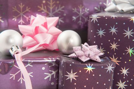 Christmas presents in purple pink and silverの写真素材