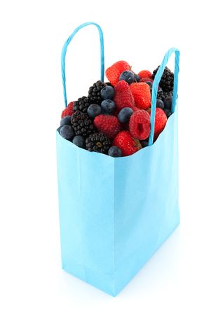 Diversity fresh forest fruit in blue bagの写真素材