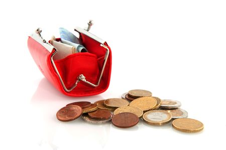 coins and banknotes in a red purseの写真素材