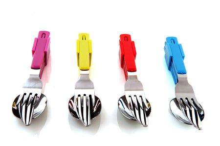 colorful forks knifes and spoons with white background