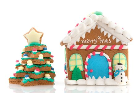 Cheerful gingerbread house on a pink backgroundの写真素材