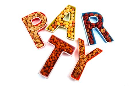 Party with funny snacks as peanuts and nuts の写真素材