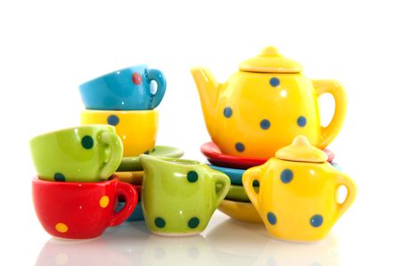colorful crockery with cups saucers teapot and platesの写真素材