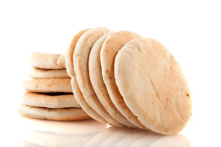 Pita flat bread stacked and isolated over white