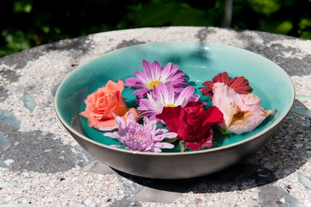 Asian bowl with colorful flowers in the gardenの写真素材