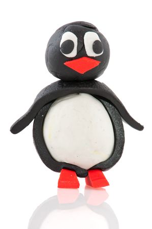 funny clay penguin puppet isolated over whiteの写真素材