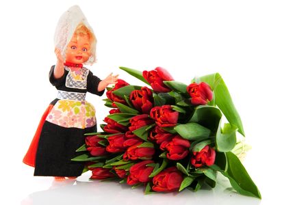 Dutch tulips with costume from Holland isolated over whiteの写真素材