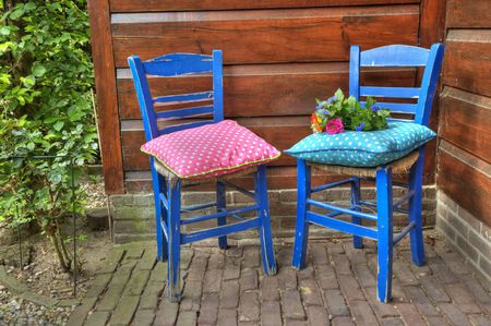 Flowers on the blue Greek chair in HDR technicsの写真素材