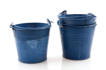 Old metal blue buckets isolated over whiteの写真素材