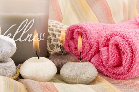 wellness in gray and pink with burning candlesの写真素材