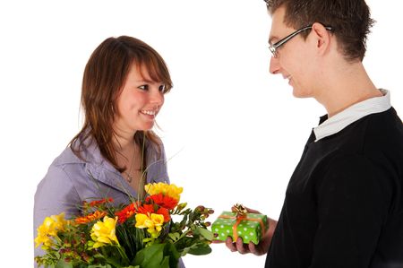 Girl is getting present and flowers from her boyfriendの写真素材