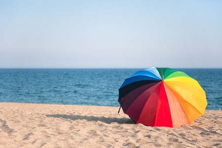 Colorful empty beach with parasol and nobodyの写真素材