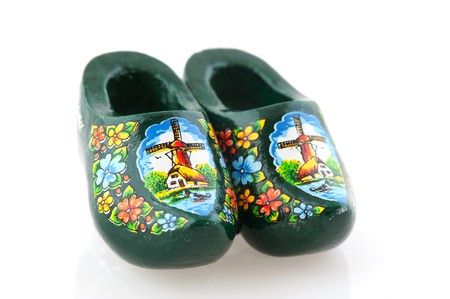 Typical Dutch wooden clogs on white background