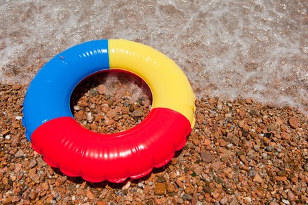Colorful plastic floating toy at the beachの写真素材