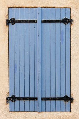 lavender colored closed blue wooden blinds from residentialの写真素材
