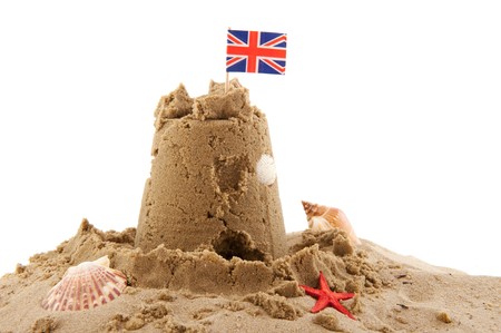 Beach with sand castle in England isolated over whiteの写真素材