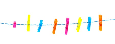 Colorful clothes pins on a laundry rope 