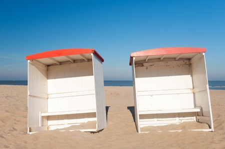 Classic wooden beach chairs in coast landscapeの写真素材