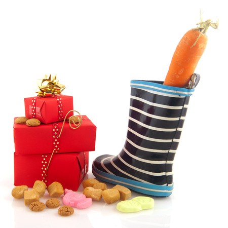 Sinterklaas shoe carrot and candy isolated over whiteの写真素材