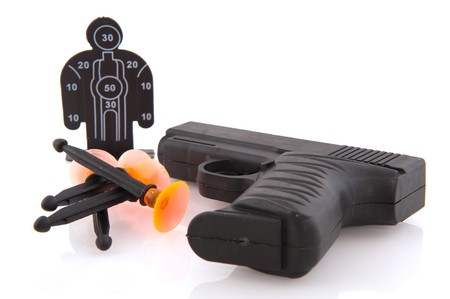 Black plastic toy gun isolated over white