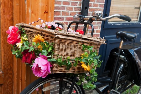Dutch transport bike with basket and cheerful flowersの写真素材