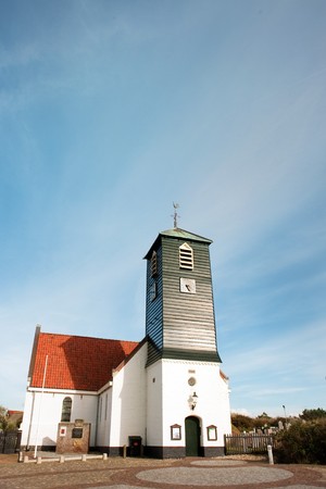 Typical Dutch church in coast village Callantsoogの写真素材