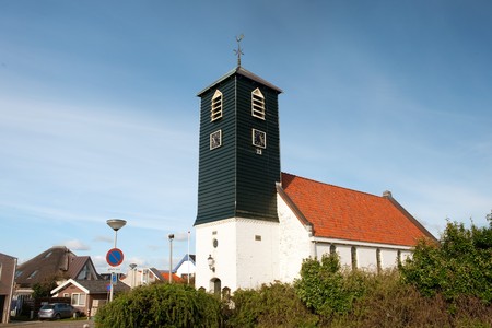 Typical Dutch church in coast village Callantsoogの写真素材
