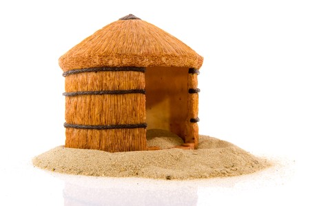 African straw hut in the sand isolated over whiteの写真素材