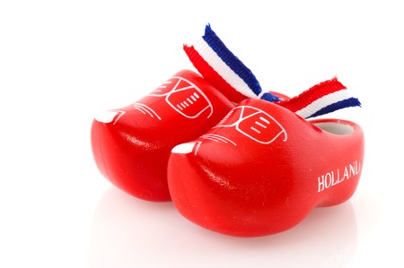 Red Dutch wooden clogs isolated over white
