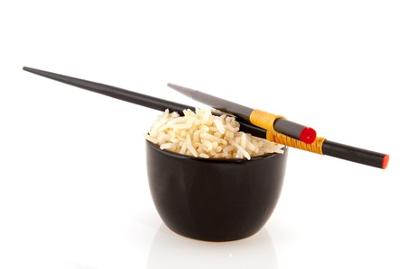 Japanese rice in black bowl with chop sticksの写真素材