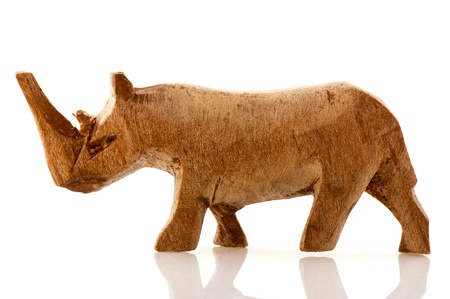 wooden Rhinoceros in miniature isolated over whiteの写真素材