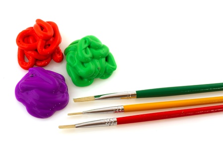 Colorful paint in yellow black green red and purple