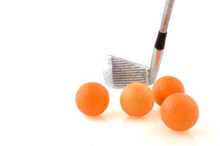 Playing golf with club and many ballsの写真素材