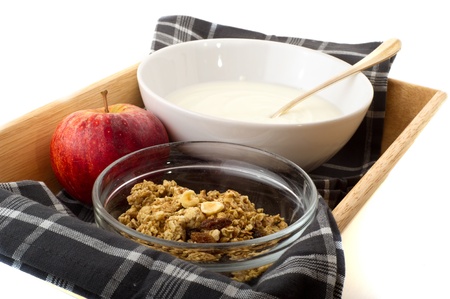 Healthy breakfast with yoghurt and muesli on trayの写真素材
