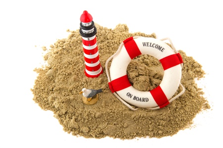 Coast with lighthouse life buoy and seagull の写真素材