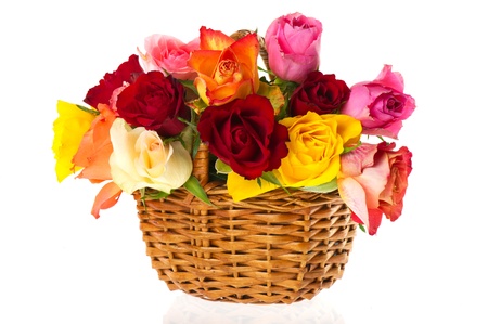 wicked cane basket with colorful roses isolated over whiteの写真素材