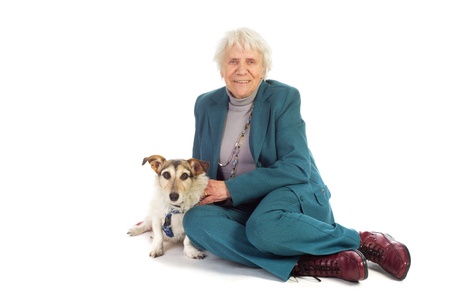 Elderly woman with her Jack Russel dog sitting at the floorの写真素材