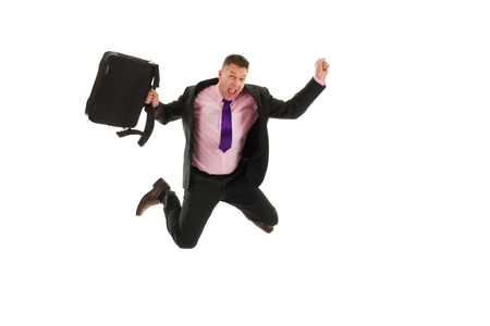 Happy business man is jumping with laptop bagの写真素材