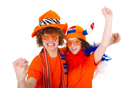 Young couple in orange outfit is supporting the Dutch soccer teamの写真素材