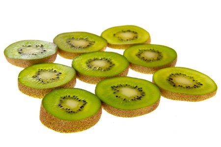 Green slices of transparency kiwi on whote bakcgroundの写真素材