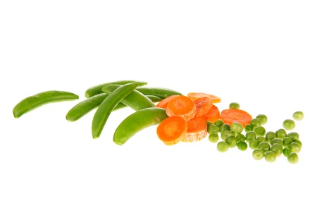 Fresh vegetables as sugar snaps green peas and slices carrottesの写真素材