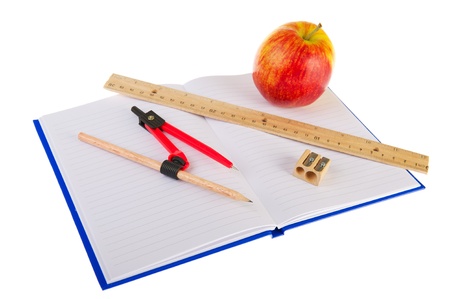 Open excercise book with ruler and pencil