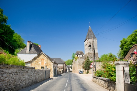 Typical French village in the Dordogne with road and churchの写真素材