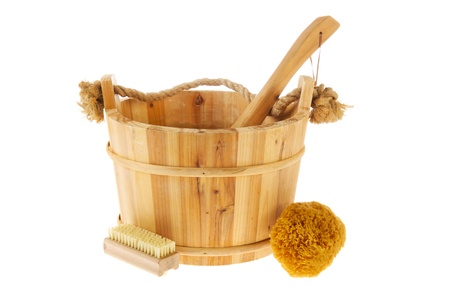Wooden sauna bucket with spoon isolated over white backgroundの写真素材