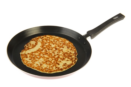 Frying pan with pancake isolated over white backgroundの写真素材