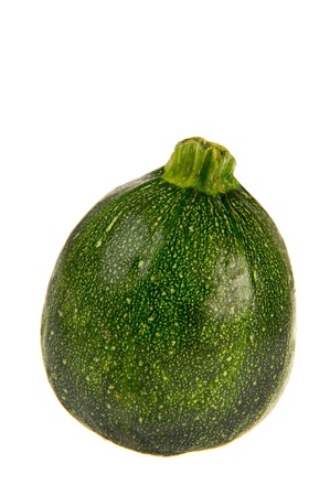 Round green courgette isolated over white backgroundの写真素材