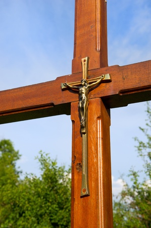French religious wooden cross with Jesus in natureの写真素材