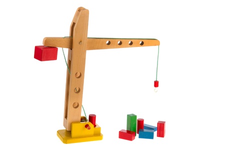 construction site with wooden crane and colorful blocksの写真素材