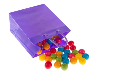 Purple candy bag with colorful chewing gum ballsの写真素材
